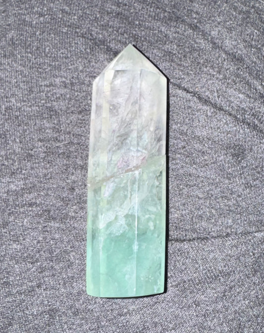 Crystal tower on a textured gray surface