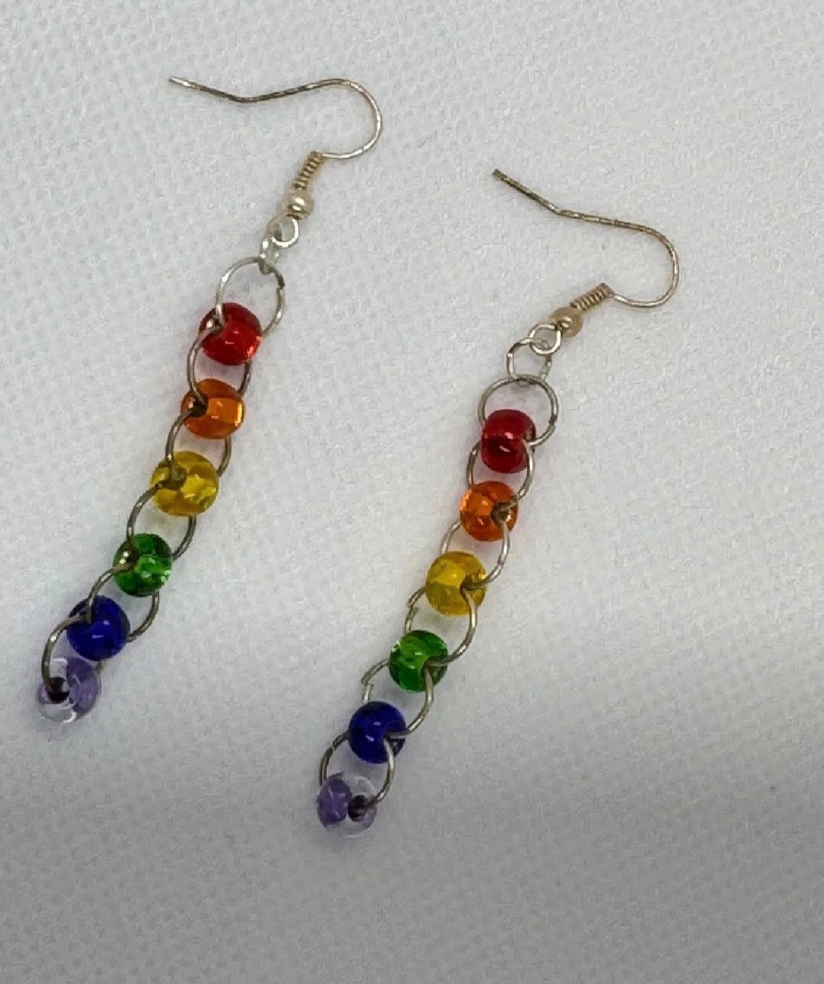 Colorful beaded earrings on a white background