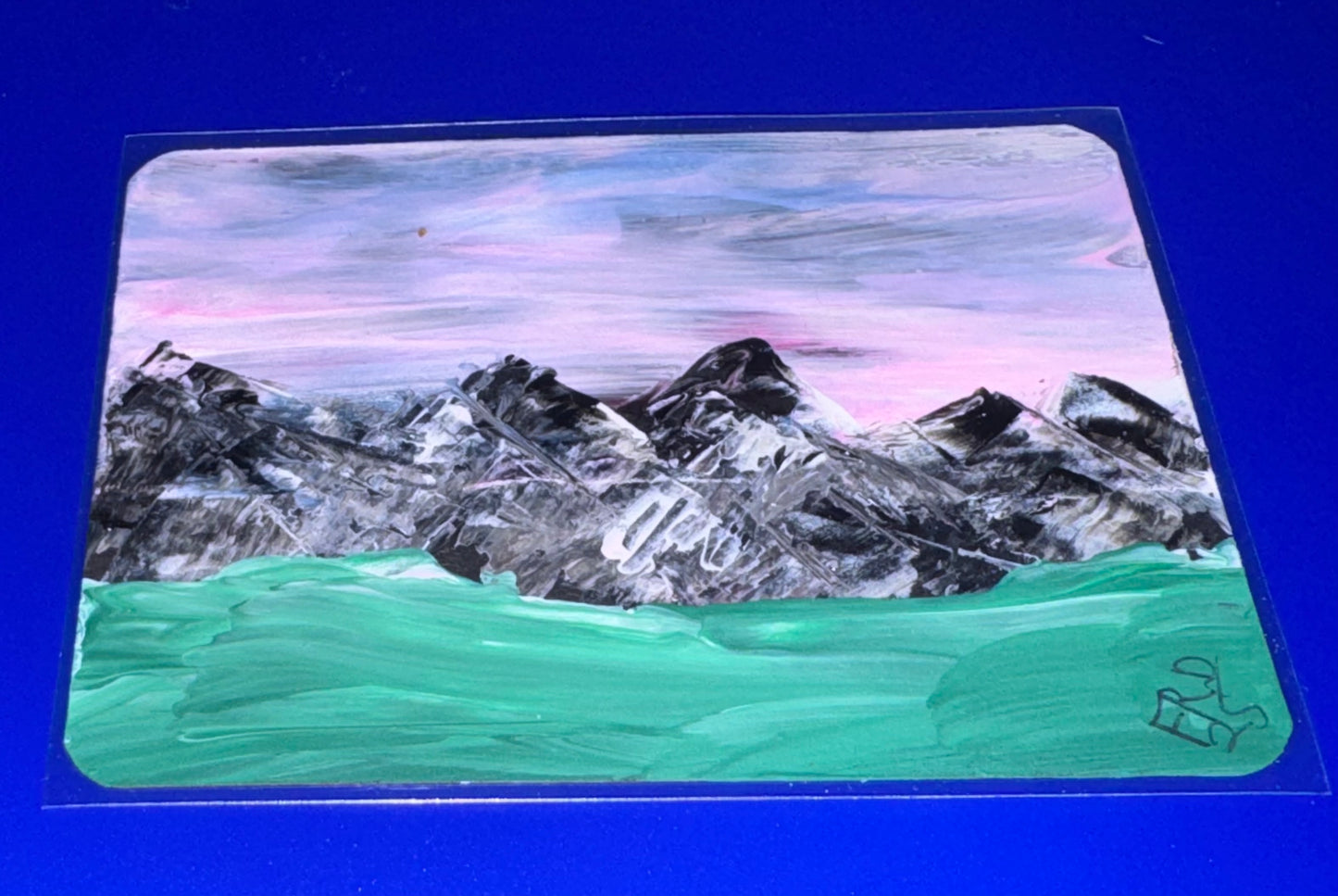 Painting of mountains and water on a clear background