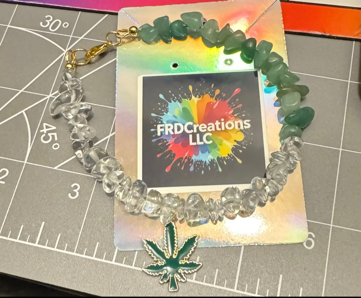 Green Aventurine and Clear Quartz Bracelet with green leaf charm on a branded card