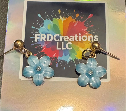 Blue flower earrings on a card