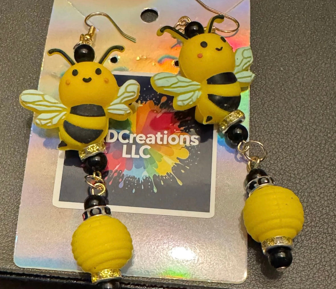 Bee-shaped earrings on a card
