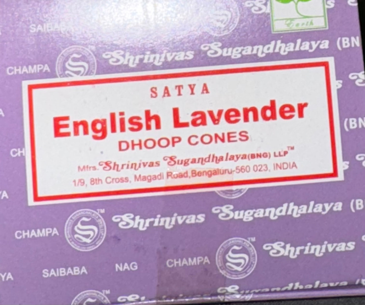 A close-up of a purple box of Satya Lavender English Dhoop Cones by Shrinivas Sugandhalaya, featuring a white label with red text and border.