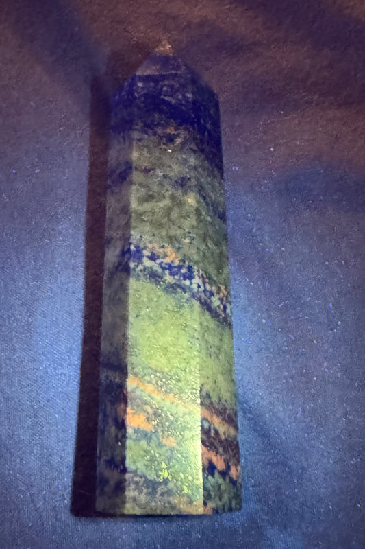 Decorative vase with multicolored pattern on a dark background