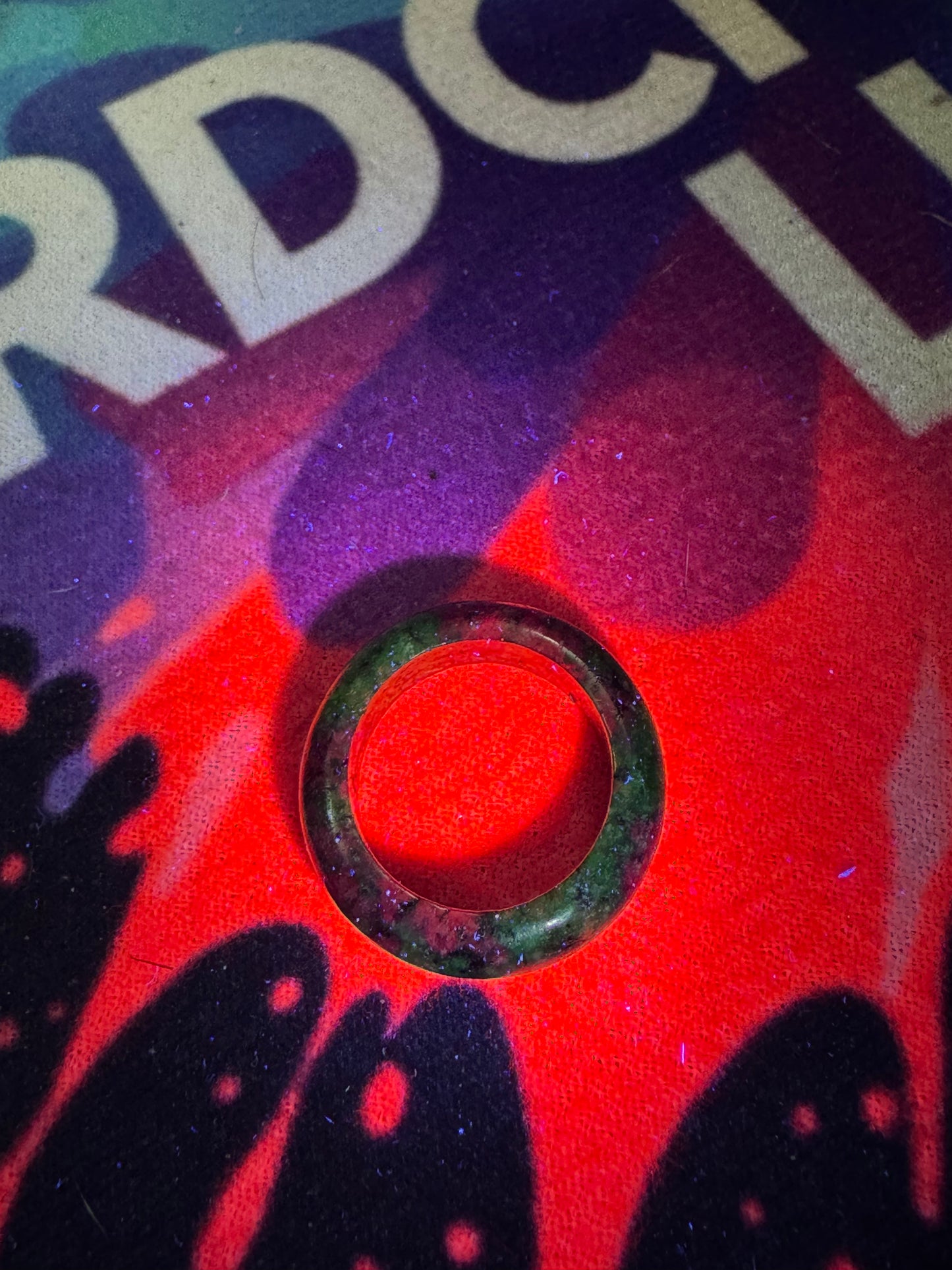 Ruby in zoisite ring under black light