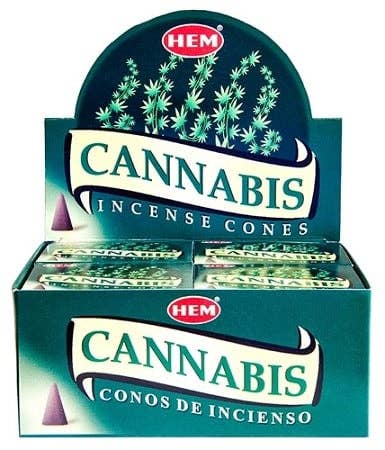A display box of HEM Cannabis Incense Cones, featuring teal packaging with illustrations of green cannabis leaves and the brand logo in red.