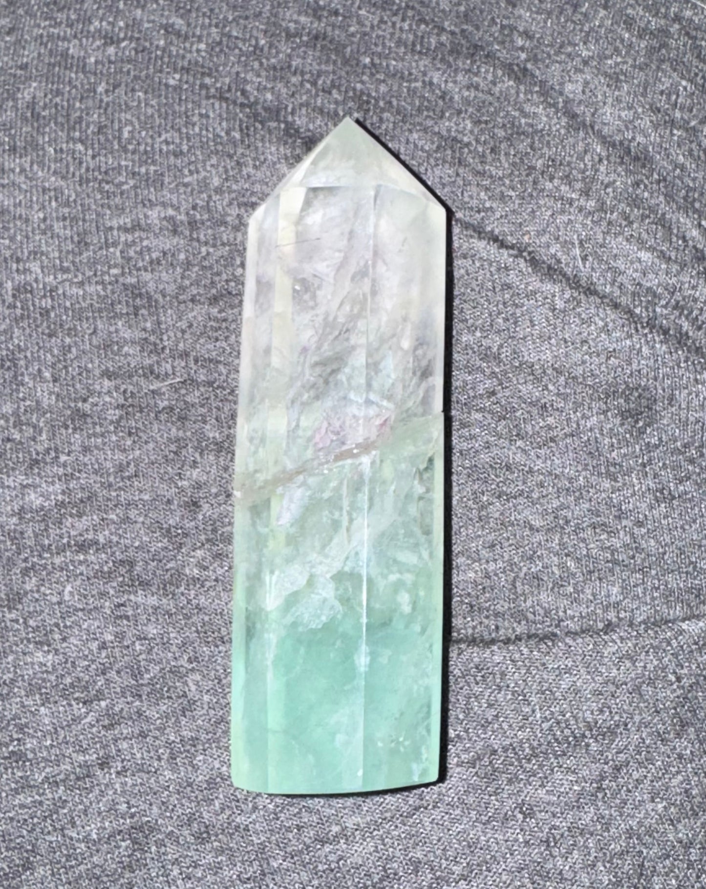 Crystal tower on a textured gray surface