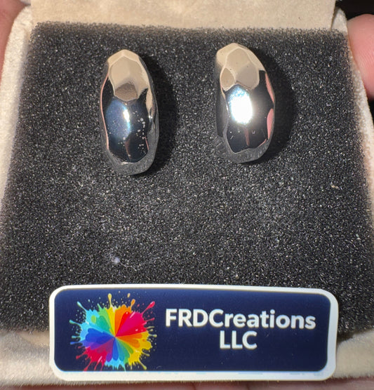 Two silver rings in a box with a FRD Creations LLC label.