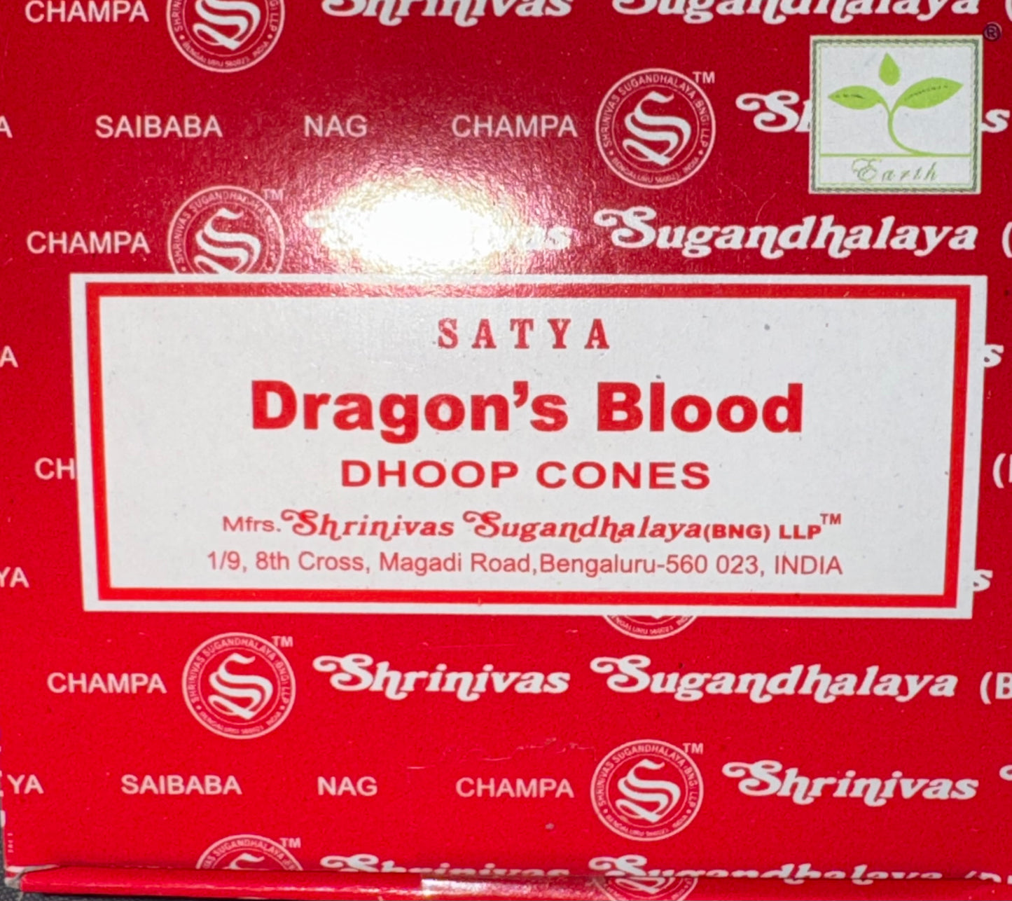 Red box of Satya Dragon's Blood Dhoop Cones by Shrinivas Sugandhalaya, featuring a white label with red text and a green leaf logo in the top right corner.