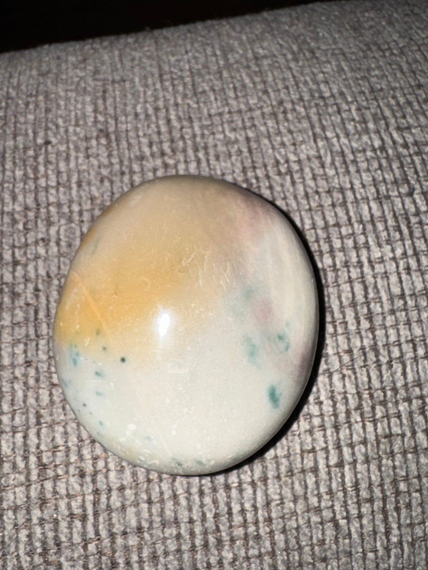 Round stone on a textured surface