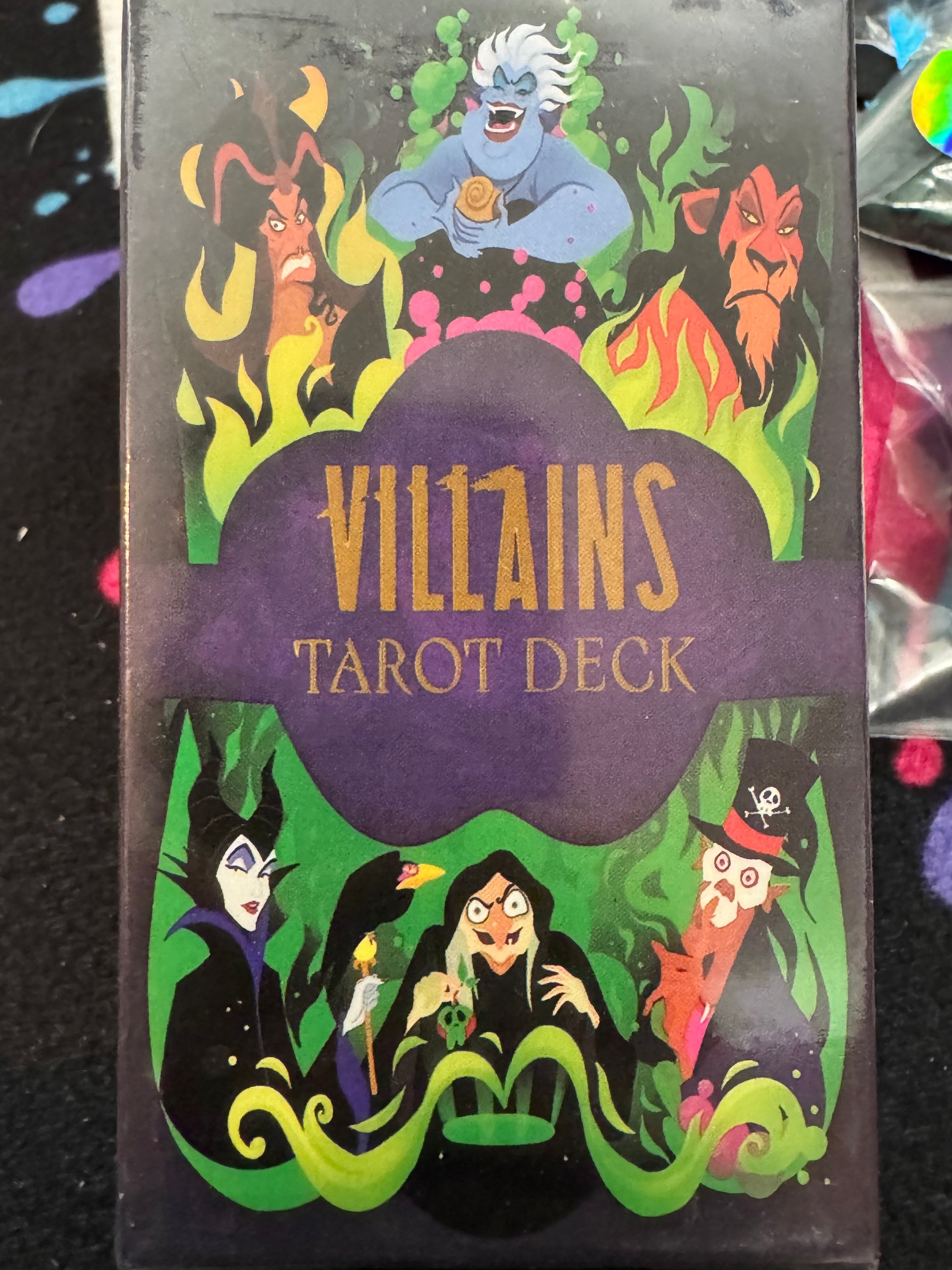 Villains Tarot Deck packaging with colorful illustrations of characters on a black background