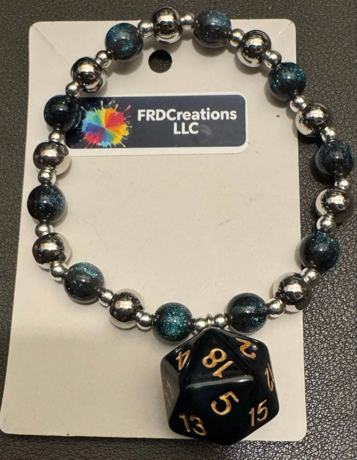 Blue and Sliver Beaded bracelet with a blue dice charm 