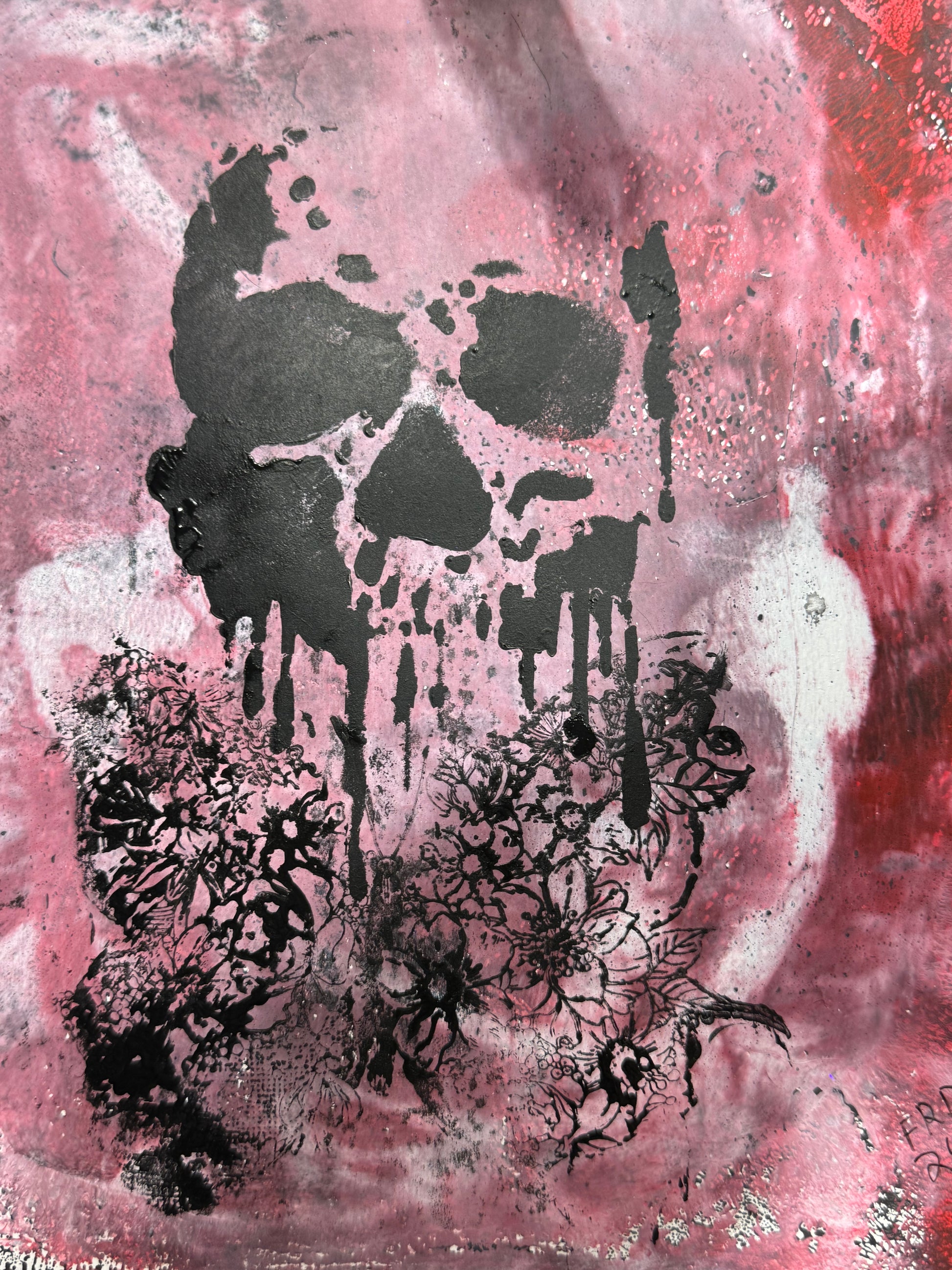 Abstract art print featuring a dripping black skull design over a textured pink, red, and white background with distressed splatters.