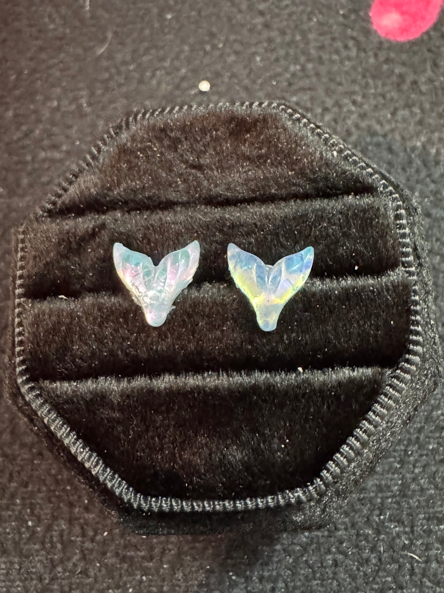 Mermaid Tail-shaped earrings in a black velvet box