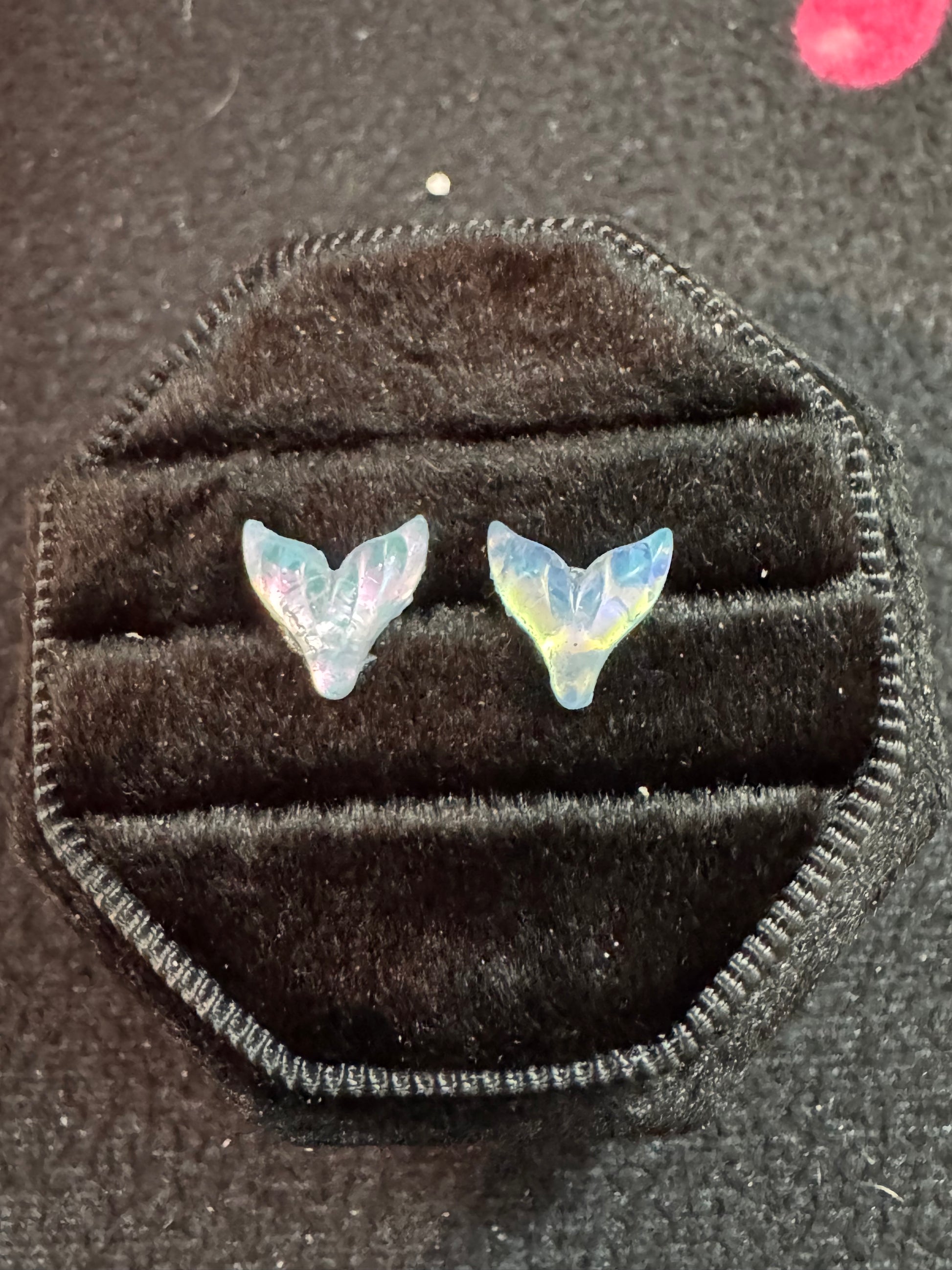 Mermaid Tail-shaped earrings in a black velvet box