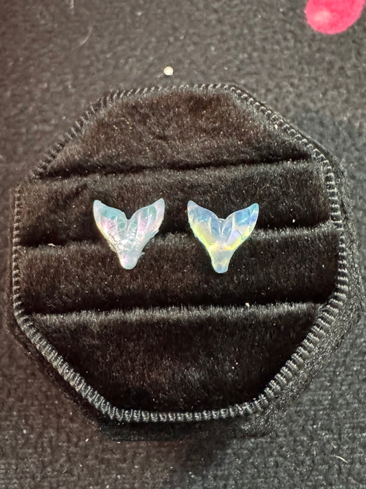 Mermaid Tail-shaped earrings in a black velvet box