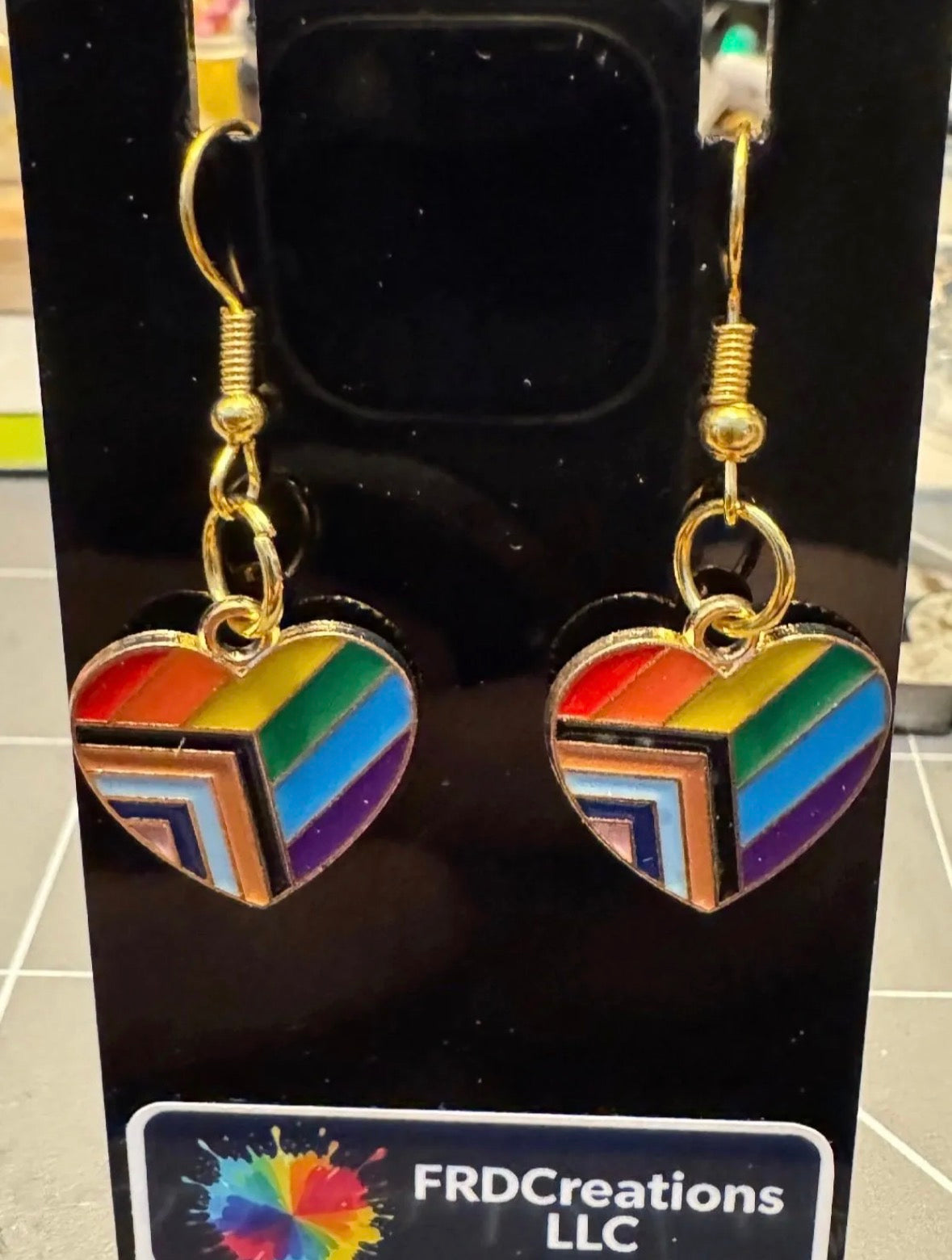 Progress pride flag heart dangle earrings. 