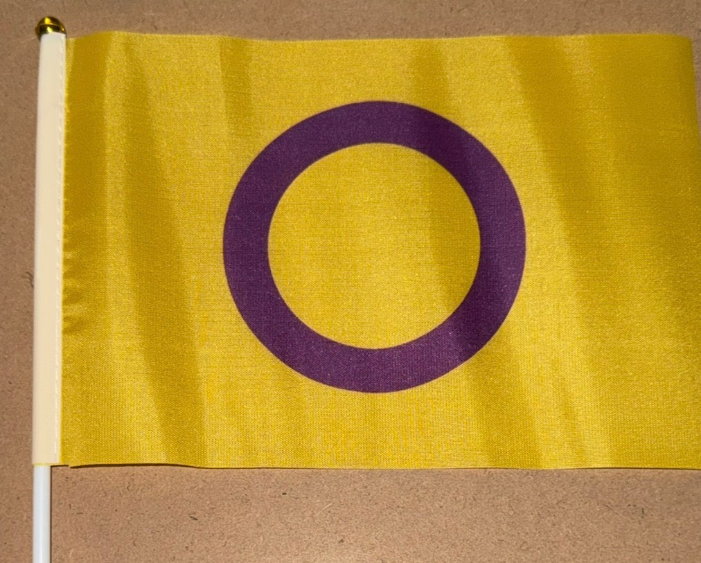 Yellow flag with a purple circle on a beige background
