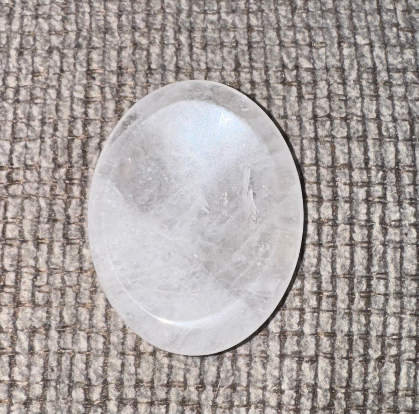 Clear stone on a textured brown surface