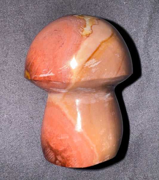 Marble-patterned mushroom-shaped object on a gray background