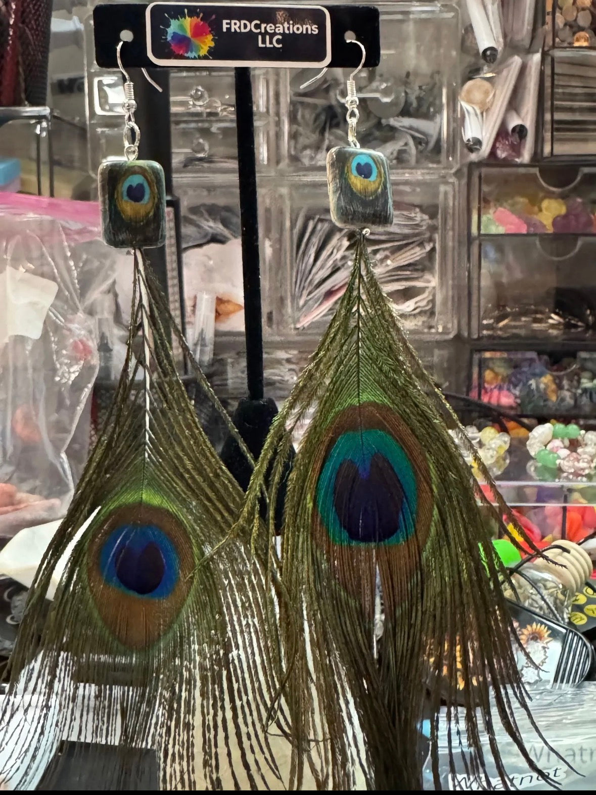 peacock feather earrings. 