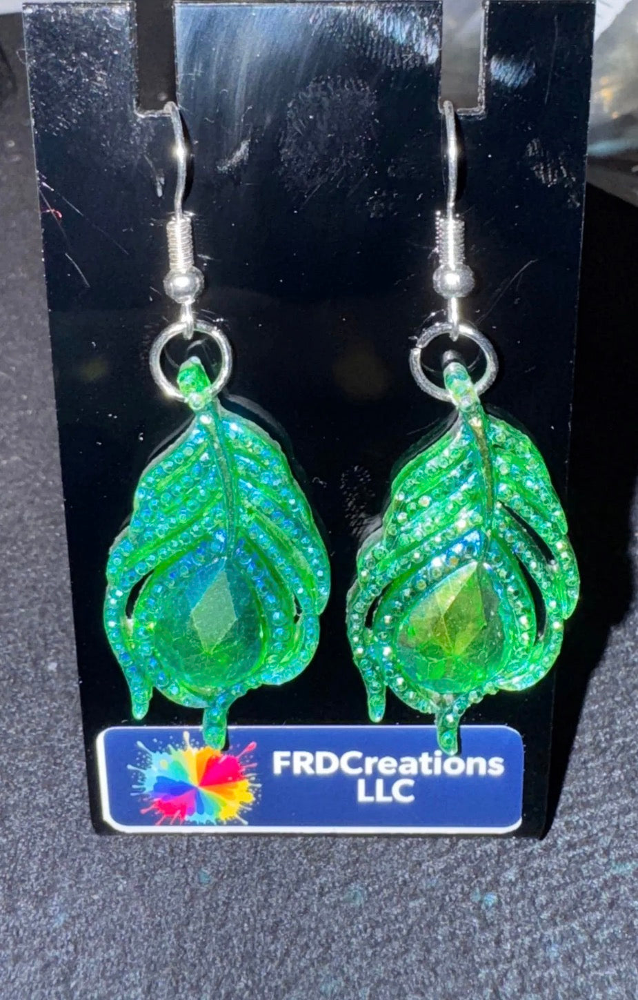 Emerald color leaf dangle earrings. 