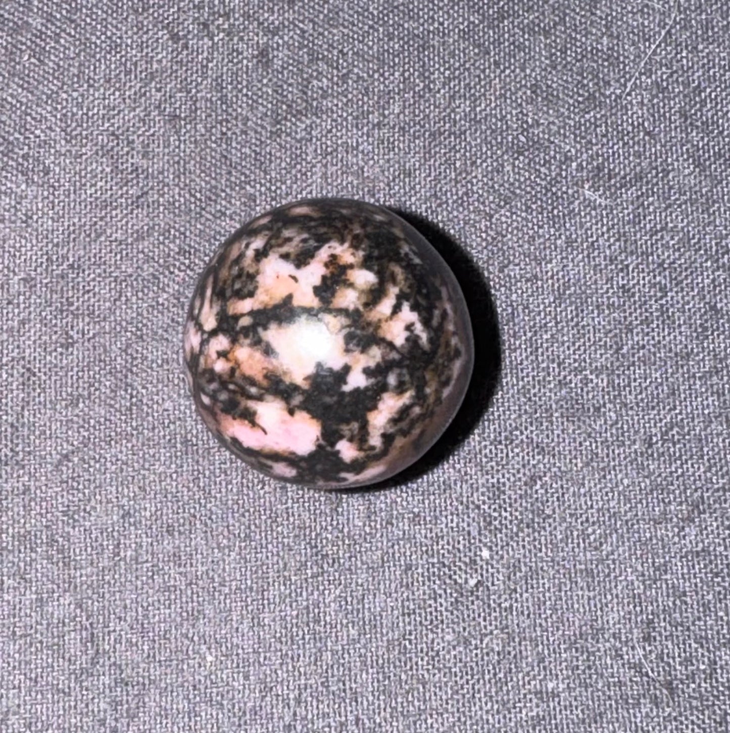 Marbled stone on a textured gray surface