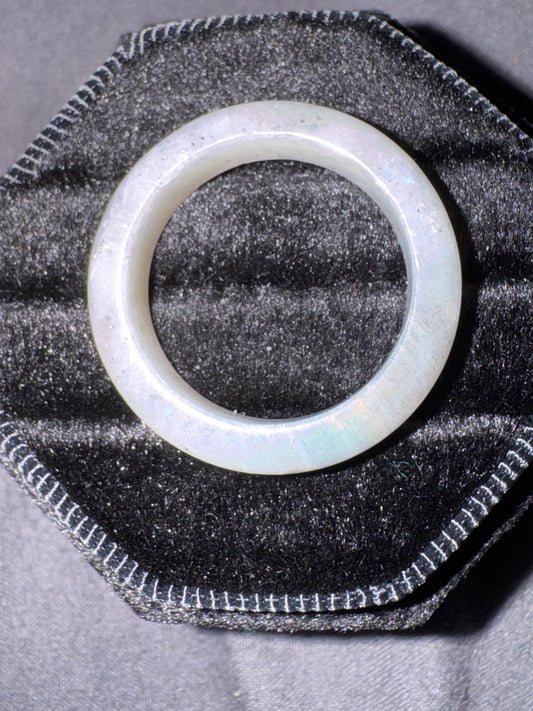 Translucent  ring on a textured black surface