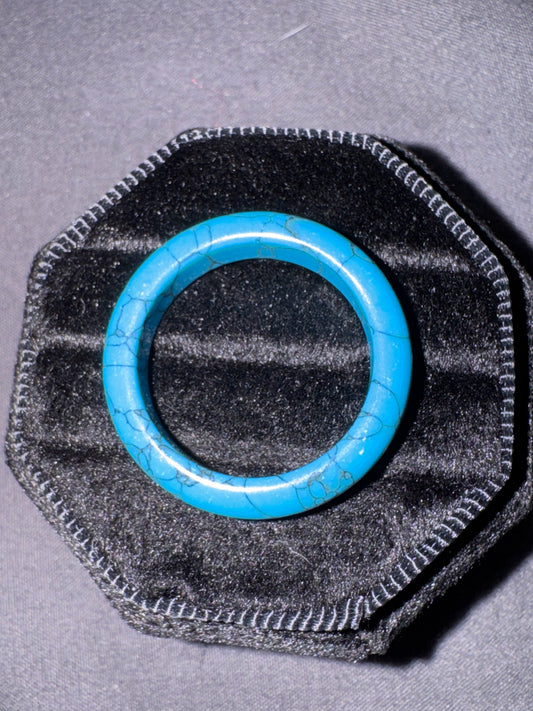 Blue ring on a textured black and gray background