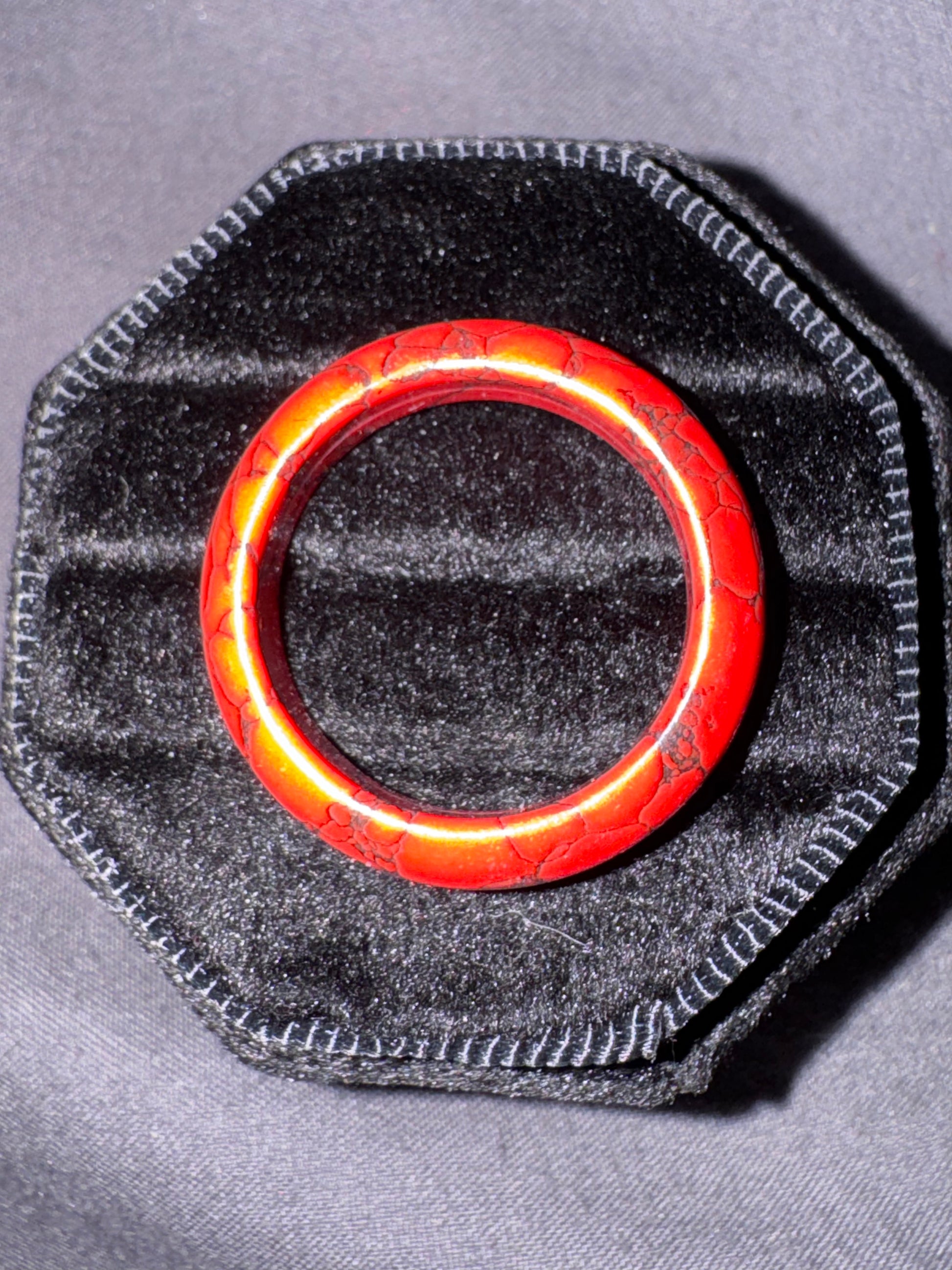 Red ring on a gray textured surface