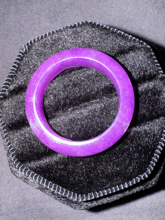 Purple ring on a textured gray surface