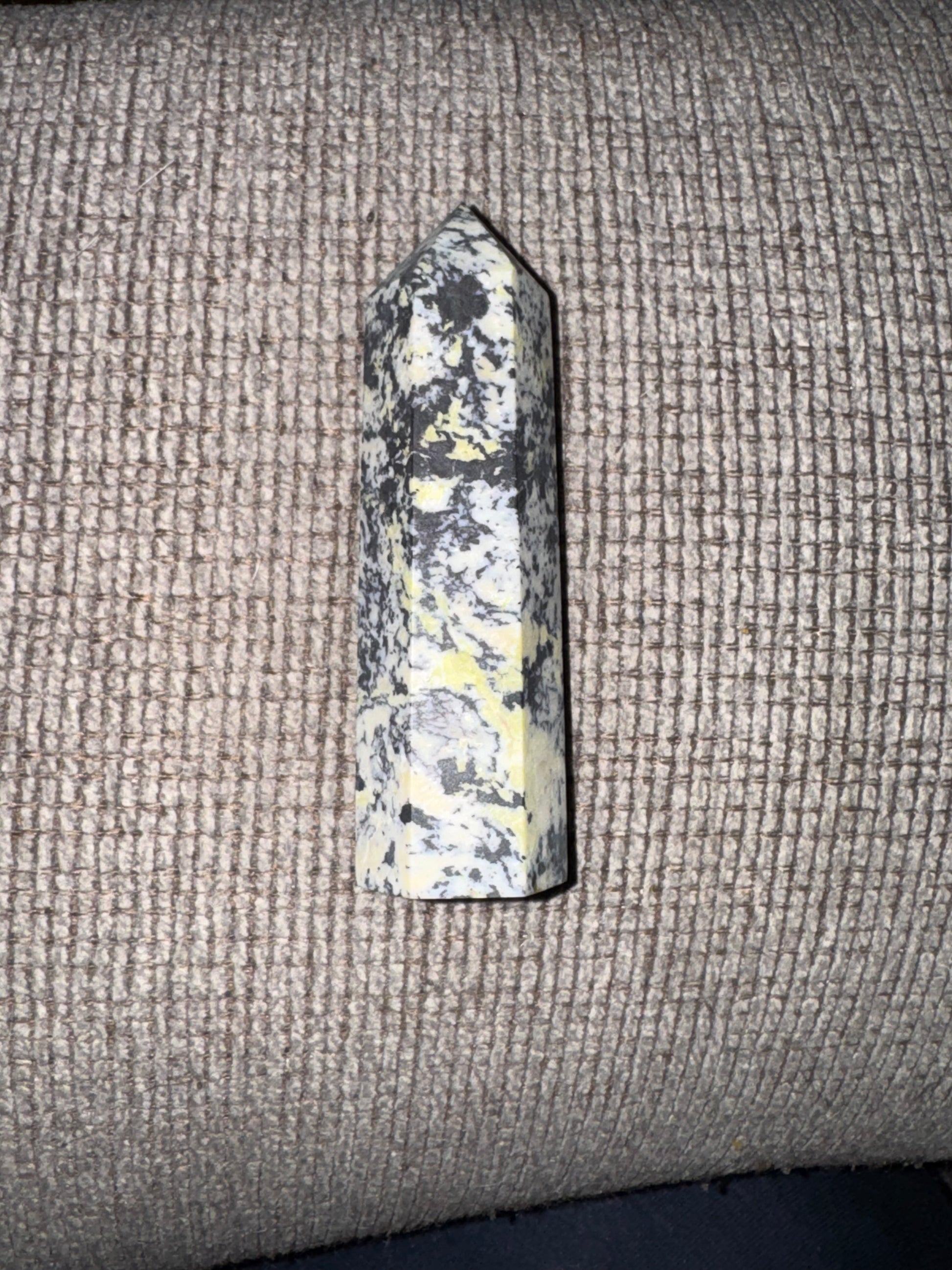 Decorative stone on a textured fabric surface