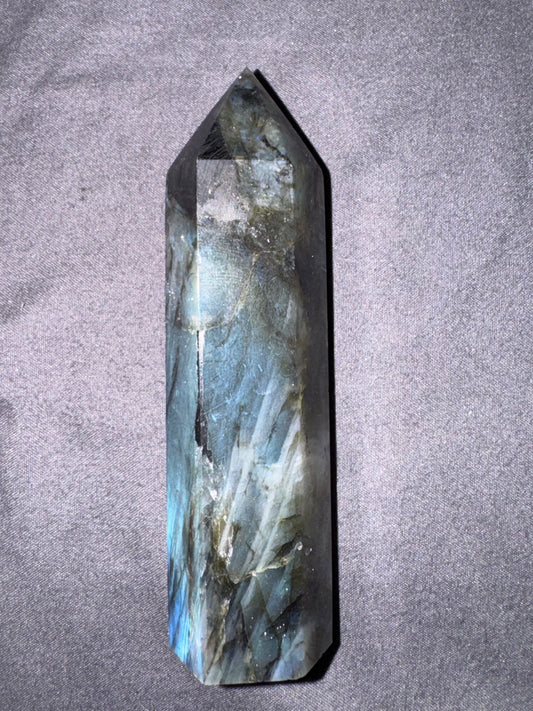 Crystal tower on a gray textured background