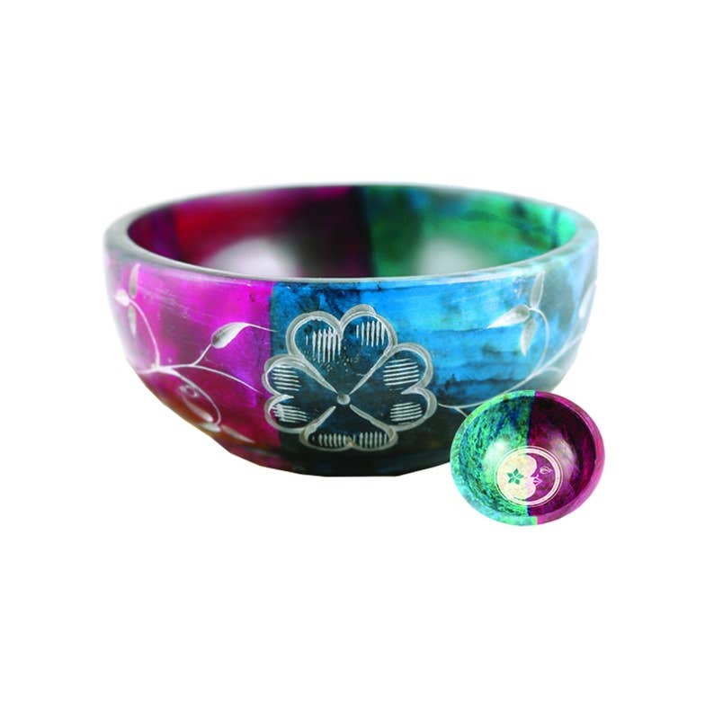 Colorful singing bowl with a white design on a white background